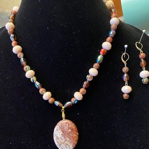 This is a genuine agate pendant necklace with matching earrings. New
